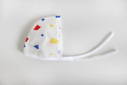 Primary Speckle Rain Bonnet