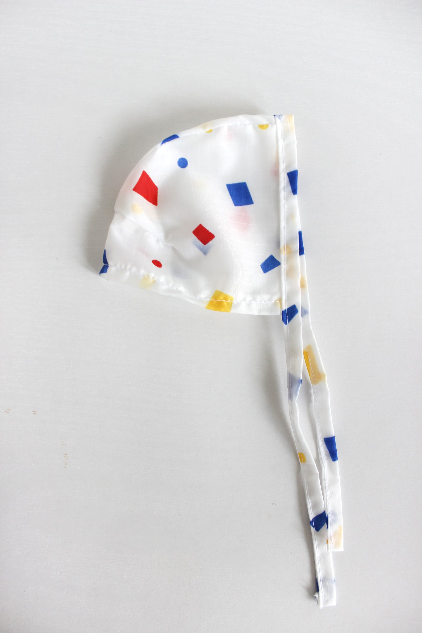 Primary Speckle Rain Bonnet